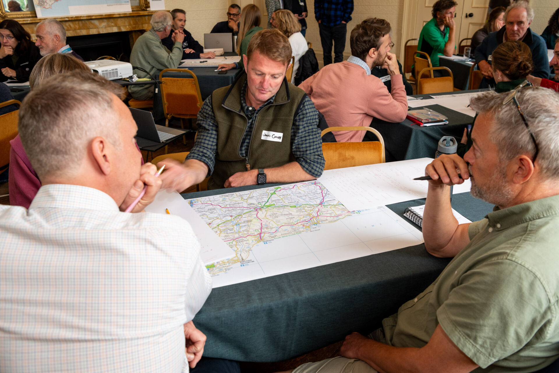 Members of the East Devon National Landscape sit at a map